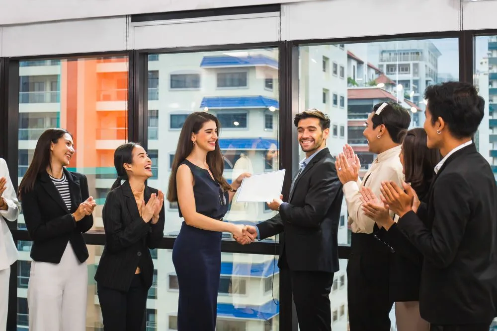 Happy employees receiving awards and gifts on Employee Appreciation Day 2026